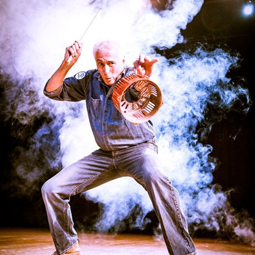 Donald Knaack with stick in hand and holding basket