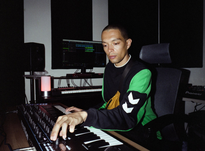 Batu in first year studio playing with synth 