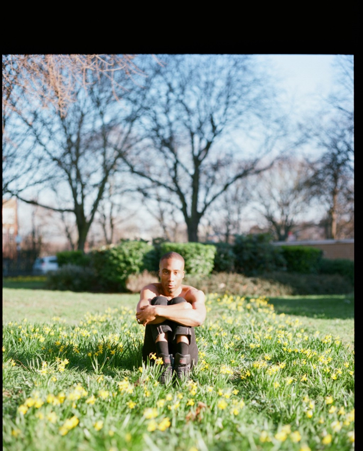 Evadney sta on gradd topless holding legs 