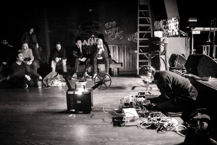 Guest sat down performing on stage with music hardware